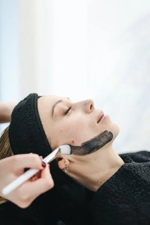 esthetician applying skincare